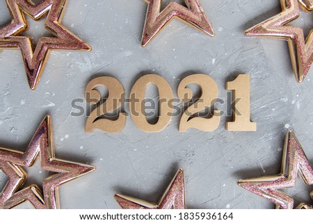 New year background with shiny golden numbers 2021. Stars frame. Minimalistic concept 