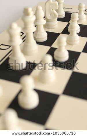 A closeup shot of chess figurines on a chessboard 