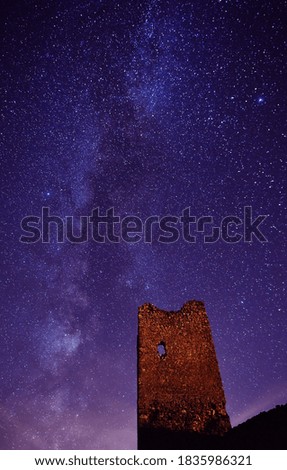 a castle with they milky way in the background