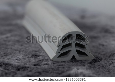 extruded rubber dilatation profile, close up Royalty-Free Stock Photo #1836003391