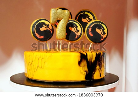 Glossy fire dragon cake for a seven-year-old child.