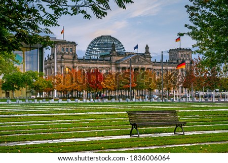 The building of Bundestag in soft sunset lighting, autumn in Berlin, Germany. Inscription on the building "Dem Deutschen Volke" in German means "For German people". Royalty-Free Stock Photo #1836006064