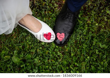 legs of the bride and groom with the middles, view from above, symbol of love, marriage and marriage