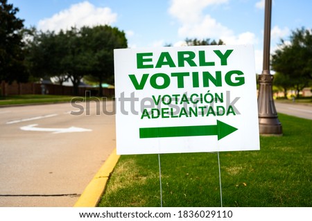 A sign directs residents to an early voting polling location for the 2020 Presidential election.