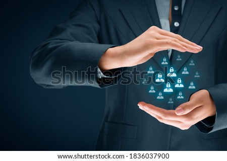 GDPR (general data protection regulation) concept. Business woman or IT technologist with protective gesture and icons of people with lock instead of head. Royalty-Free Stock Photo #1836037900