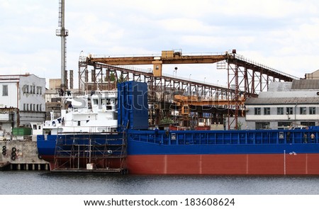 Photo of a blue and red industrial ship