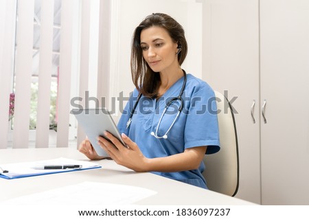 Telemedicine, Medical online, e health concept. Doctor video chat , explaining with patient via tablet computer, mobile health application. Doctor teleconferencing with medical team in hospital Royalty-Free Stock Photo #1836097237