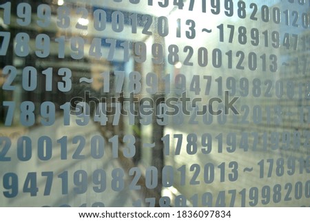 Digits on  glass surface abstract background