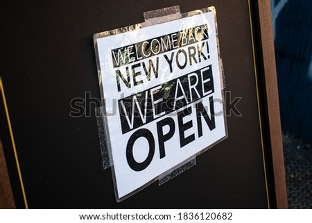An New York we're open sign for businesses hurting.