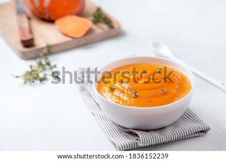 mashed sweet potatoes in a wooden bowl on a light background Royalty-Free Stock Photo #1836152239