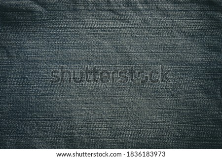 black denim background is a fabric that fades and fades