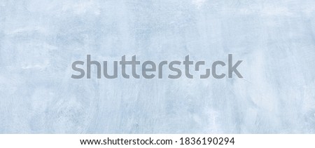 Abstract Wide Angle light blue stucco Background. Wall building Close up. Rough Surface plaster Texture With Copy Space for design Royalty-Free Stock Photo #1836190294
