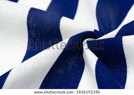 Cotton fabric, white and blue stripes. strict laconic design. Modern geometric backgrounds. Texture background pattern