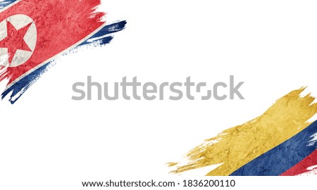 Flags of North Korea and Colombia on white background

