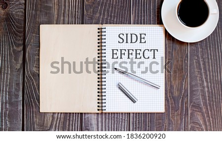 Word Writing Text SIDE EFFECT with pen and cofee. business concept on wooden background