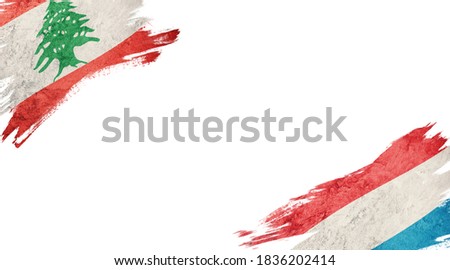 Flags of Lebanon and Luxembourg on white background
