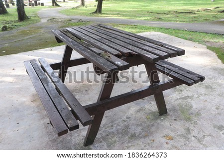 Photo of broken wooden table at the park. Selective focus photo.