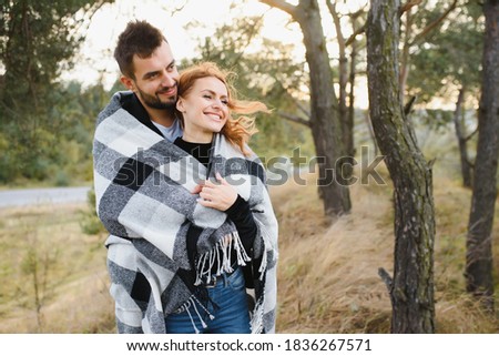 Romantic young couple in love relaxing outdoors in park