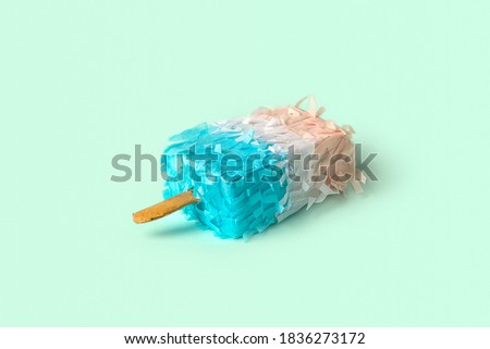 Paper creative popsicle decoration on abstrcat pastel blue background. Ice cream in minimal style. Creative Xmas concept.