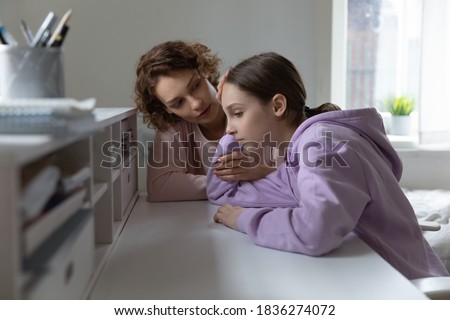 Loving Caucasian mom comfort support unhappy teenage 13s daughter feeling lonely at home. Caring mother cheer sad teen girl child suffering from school discrimination bullying. Loner concept. Royalty-Free Stock Photo #1836274072