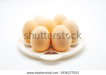 Farm eggs on a white background Royalty-Free Stock Photo #1836277021