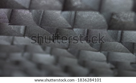black background with fabric backlit by light