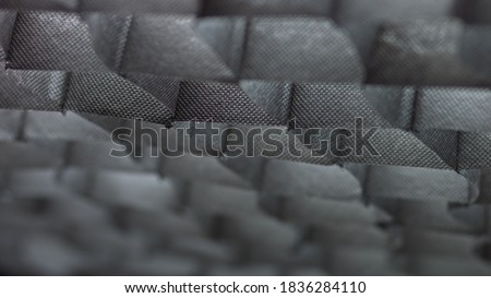 black background with fabric backlit by light