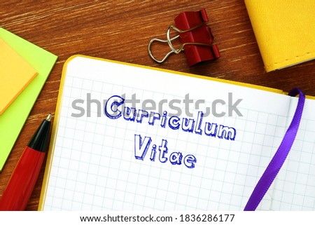 Financial concept meaning Curriculum Vitae with sign on the sheet.
