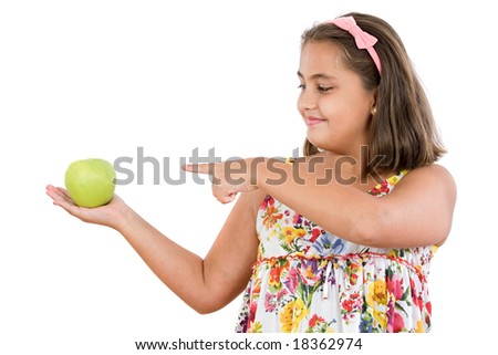 Adorable girl with an apple on a white background