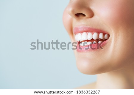 Perfect healthy teeth smile of a young woman. Teeth whitening. Dental clinic patient. Image symbolizes oral care dentistry, stomatology. Royalty-Free Stock Photo #1836332287