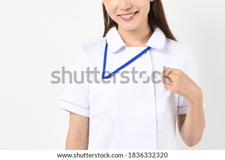 Young nurse woman smiling on white background