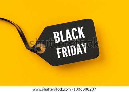Sale tag with Black Friday written on yellow background for Black Friday concept