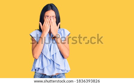 Young beautiful latin girl wearing casual clothes rubbing eyes for fatigue and headache, sleepy and tired expression. vision problem 