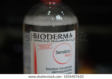 
Cleansing water in a clear plastic bottle. Close-up photo of a black background.