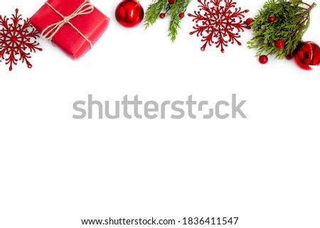 sprig of spruce, red gift, Christmas tree toy and bump. minimalism.Copy space Royalty-Free Stock Photo #1836411547