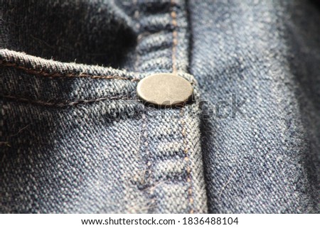 Photos close to details on old blue jeans and textured jeans.