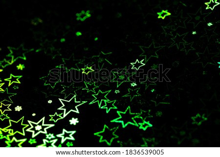 green holographic stars abstract patterned background