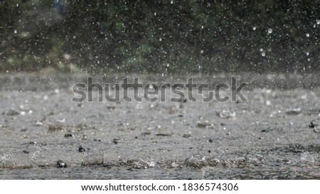 The rain was falling on the roadway due to a precipitation that was forming after the depression hit Thailand, causing heavy rains in some areas and flooding the road surface. Royalty-Free Stock Photo #1836574306