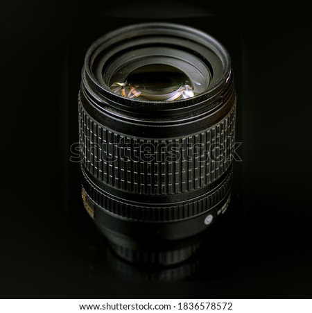 studio, product image, SLR lens on a black background