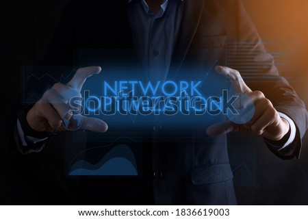 Business man hands holding inscription NETWORK OPTIMIZATION with different graphs on the background.Business, Technology, Internet and network concept.