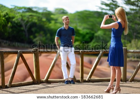 Young couple sightseeing Chamarel seven coloured earths