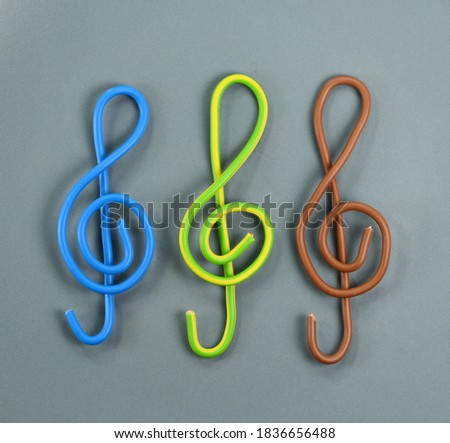 G clef made from isolated electric wire, isolated on white background. treble clef. Royalty-Free Stock Photo #1836656488