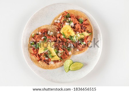 Traditional Mexican tacos al pastor
Authentic seasoned pork tacos served with sliced pineapple