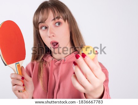 woman with a ping pong racket white background