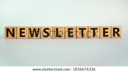 'Newsletter' written on wood blocks. Business concept. Copy space. Beautiful white background.