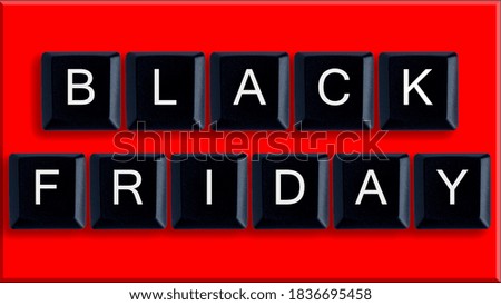 Black Friday. The inscription "BLACK FRIDAY" is laid out with the keys of the English keyboard.red background