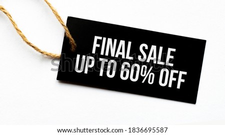 FINAL SALE UP TO 60 percents text on a black tag on a white paper background
