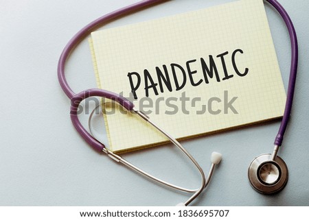 On a purple background a stethoscope with yellow list with text PANDEMIC