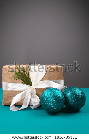 Blue Christmas balls with gift wrapping on a blue background
