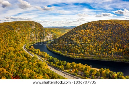 Aerial view of Delaware Water Gap on a sunny autumn day. The Delaware Water Gap is a water gap on the border of the U.S. states of New Jersey and Pennsylvania Royalty-Free Stock Photo #1836707905